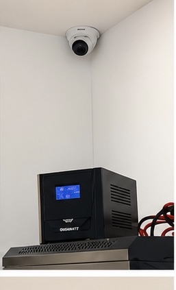 Ceiling-mounted CCTV dome camera with UPS backup power system installed by Sha Technical Solutions Ltd.